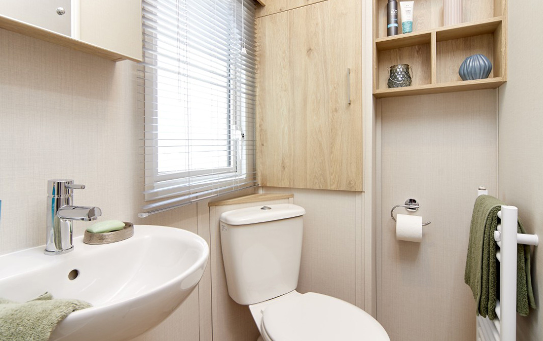 main bathroom with sink and toilet in the Bayview caravan