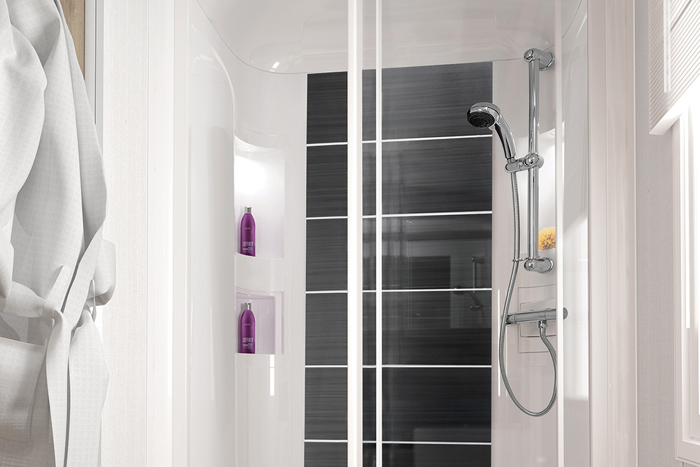Shower with black tiles in the Bordeaux Escape caravan