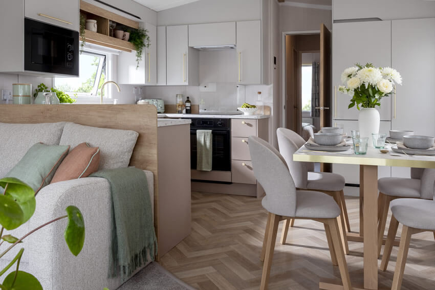 A modern open plan living, dining and kitchen in the Burgundy caravan