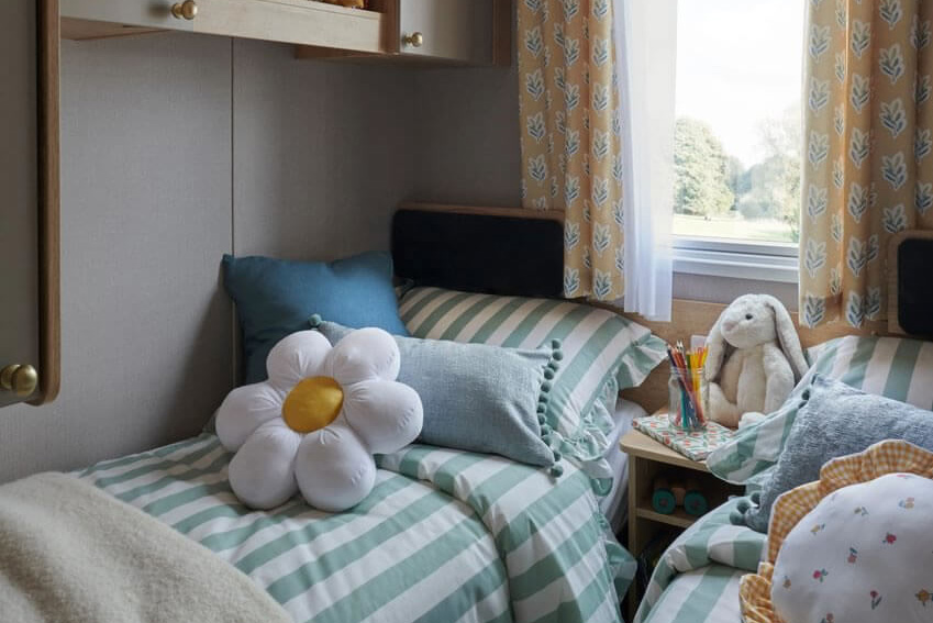 twin bedroom with window in the Provence Caravan